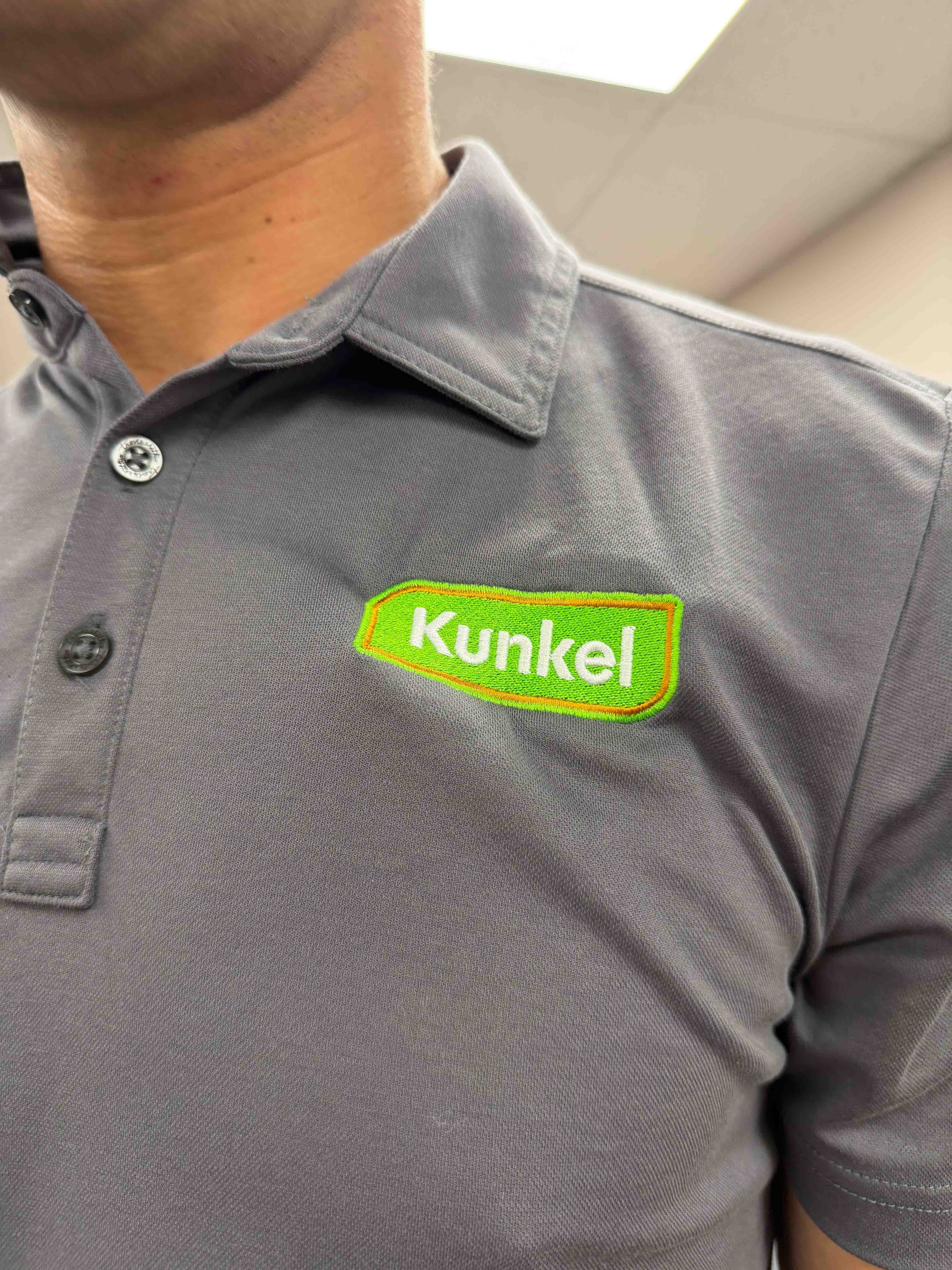 Kunkel team member in branded apparel